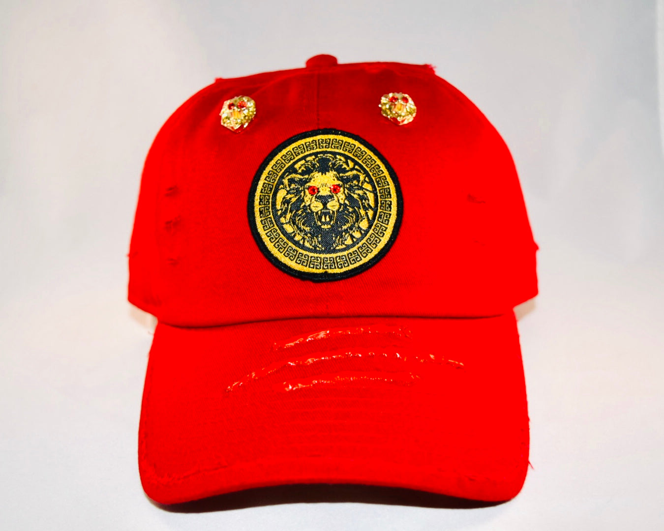 Signature Ruby Eye Lion-Emblem Medallion Red Cap