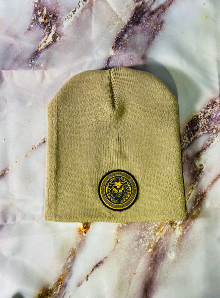 Signature Ruby Eye Lion-Emblem Medallion Desert Tan Beanie