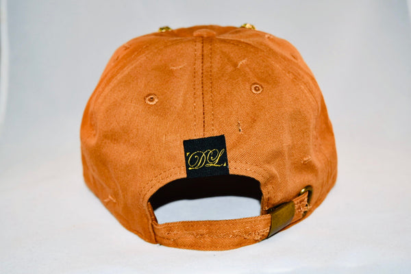 Signature Ruby Eye Lion-Emblem Medallion Tan Cap