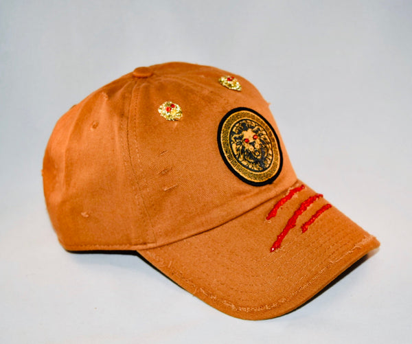 Signature Ruby Eye Lion-Emblem Medallion Tan Cap